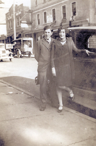 A young couple and a car