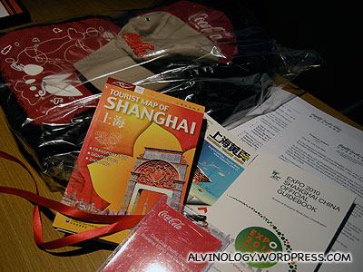 Welcome gifts from Coca-Cola - a bag made of recycled bottles; Shanghai map; Expo guide; Shanghai phone directory; a cap; among many other items