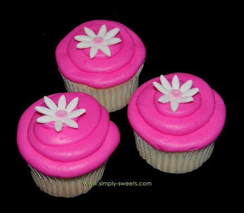 hot pink cupcakes with flower