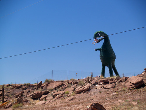 Dinosaur eating a mannequin