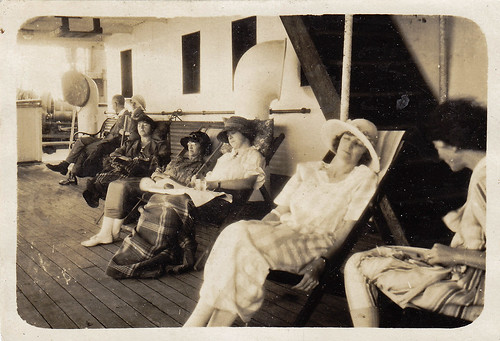 Lounging on the promenade deck. Unidentified ship. 