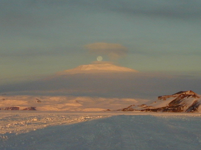 full moon over mt erebus volcano-antarctica
