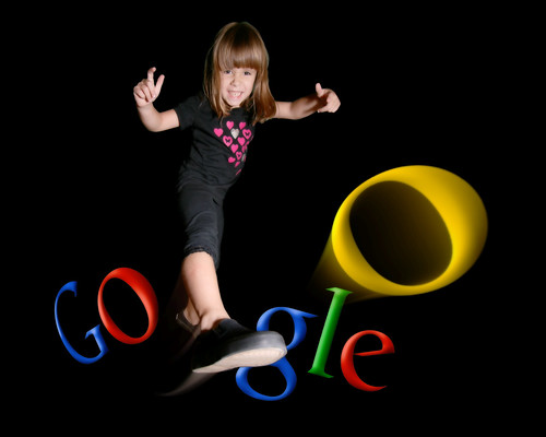 Image of a girl kicking one of the 'o's in Google