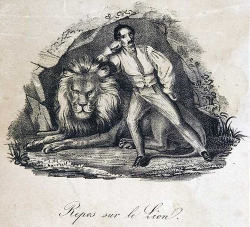 lion tamer rests on lion