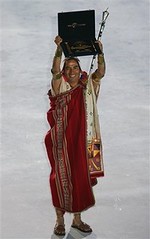 Peru's representative holds up the award after Machu Picchu temple was declared one of the new Seven Wonders of the World during the official declaration ceremony Saturday, July 7, 2007 at Luz stadium in Lisbon, Portugal.