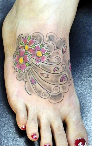 cherry blossom foot tattoo. blossom