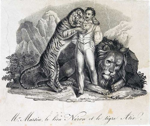 lion tamer with tiger and lion
