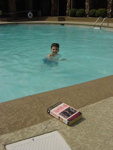 My son in the pool plus a good book (Diamond Age)