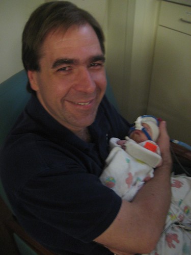 Proud Papa holding Theo after intubation tube removed