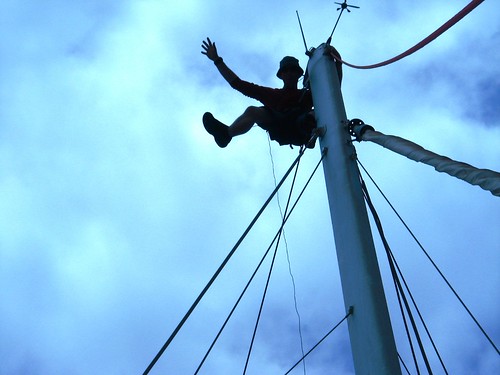 The joys of being a crew member - hoisted up the mast to check rigging (San Miguel, Tenerife, Canary Islands)