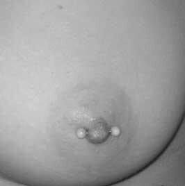 horizontal female nipple body piercing