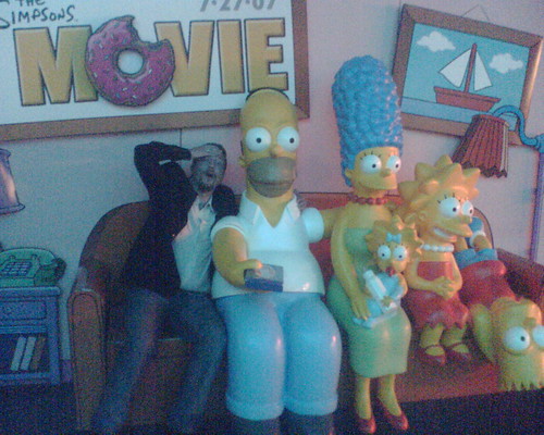 Mike on the couch with the Simpsons