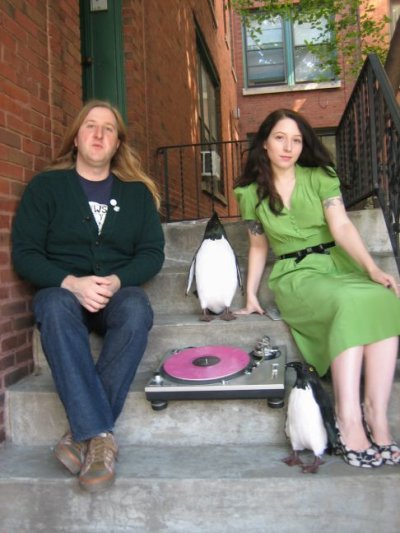 Rococo label heads - Joe and Nicole (and penguin)
