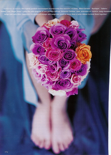 purple rose bouquet with one orange rose