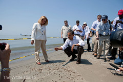 President Obama with beach tar from the Oil Spill
