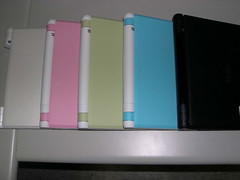 white green pink blue black laptops