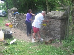 Local volunteer stonemasons applying the finishing touches to the restored bridge
