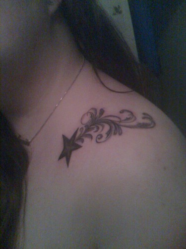 Star Tribal Tattoo at Woman Shoulder