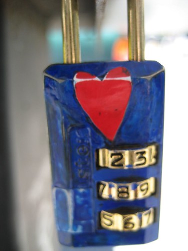 graffiti of a red heart on a blue lock