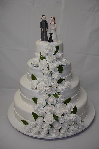 Nothing says wedding cake like a white fire tiered cake with the bride and