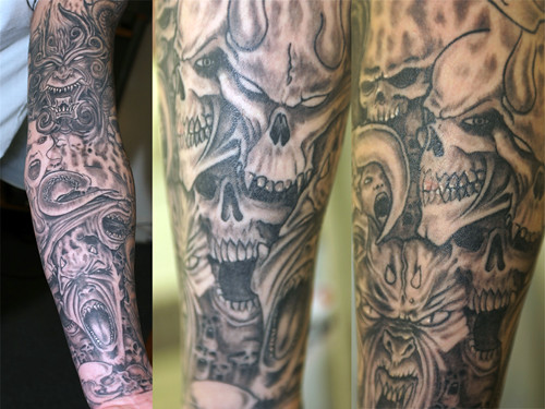 grey-evil sleeve Tattoo by The Tattoo Studio.