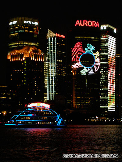 Illuminated ship against illuminated backdrop