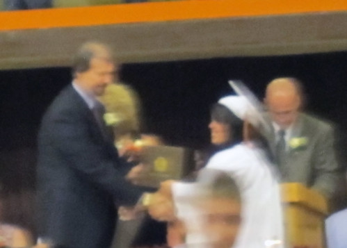 Blurry, but receiving her diploma