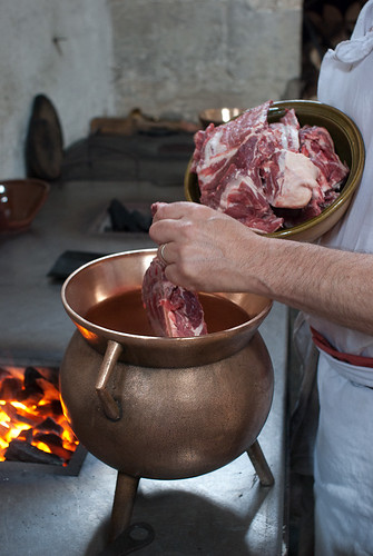filling the pot with the mutton