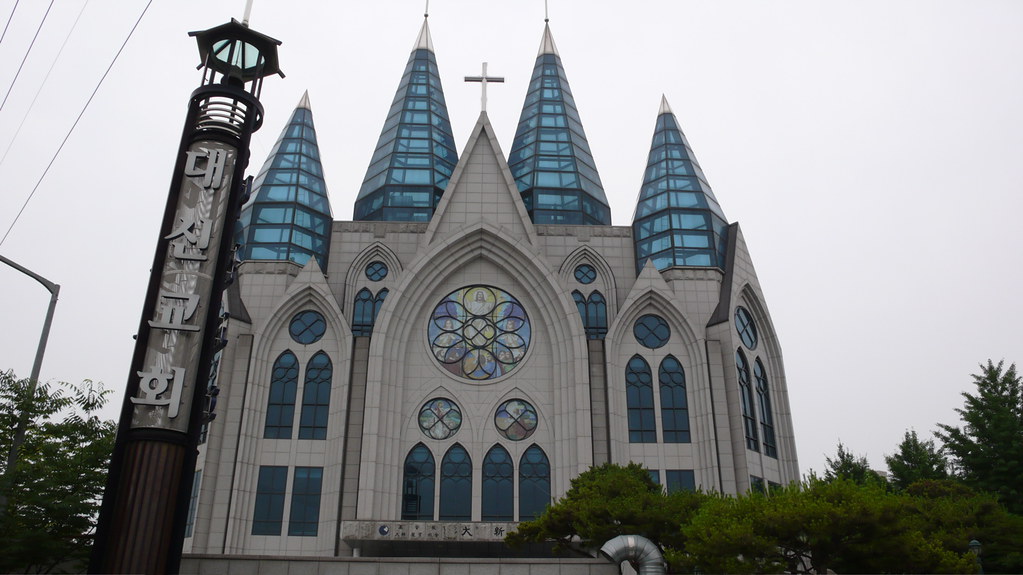 interesting modern church with four glass spires outside Onsu station, seoul
