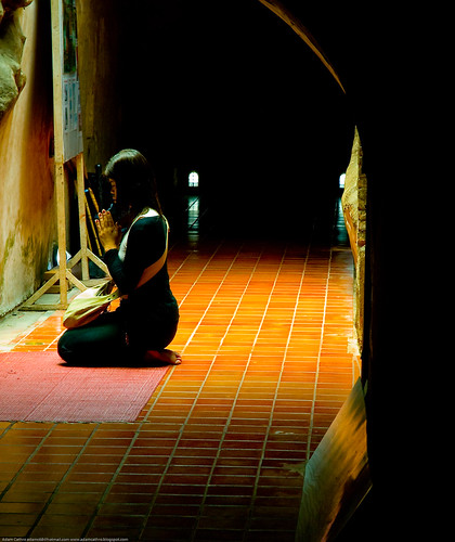 Woman praying at Wat Umong, Chiang Mai