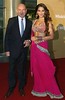 Actors Ben Kingsley, left, and Bipasha Basu stop on the red carpet for photographers while on the way to the New Seven Wonders of the World official declaration ceremony Saturday, July 7 2007 at Luz stadium in Lisbon, Portugal.