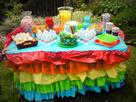rainbow garden birthday party ruffles table skirt candy bar cake