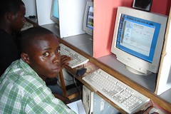 Tommy at the Internet Cafe in his village