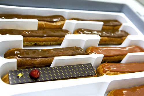 Various eclair flavors: Chocolate, Caramel and Bourbon vanilla with wild strawberries