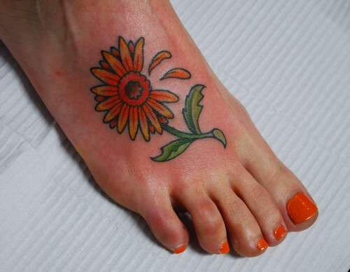 Fire Daisy Tattoo by Chris Hold. "I like orange", she said.