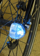 Reelight bike light on front wheel