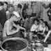 101 A crewmen rations out water for Vietnamese refugees on board USS Bayfield (APA-33) during their journey to Saigon, Indochina, from Haiphong, circa September 1954 by manhhai