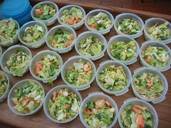 Salad in small tupperware containers
