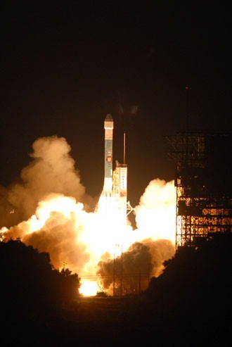 Delta II lifts off launch pad.