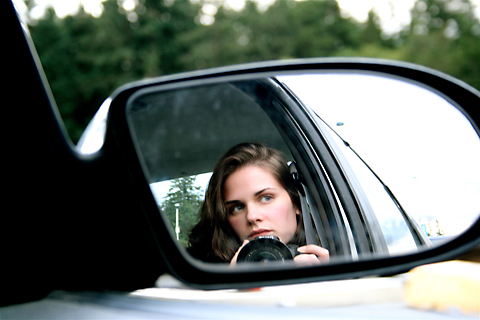 lisa in rear car view window