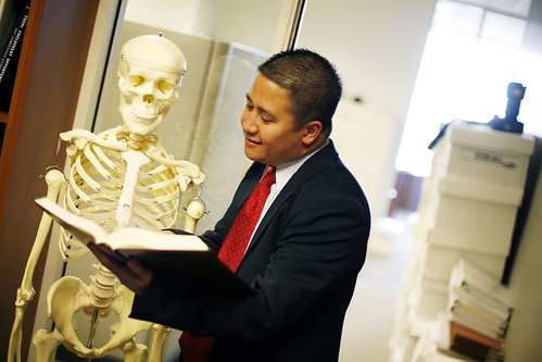 Custom Stock: Reading a legal book to a skeleton