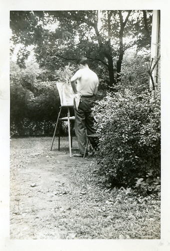 Vintage photo, man painting in his backyard
