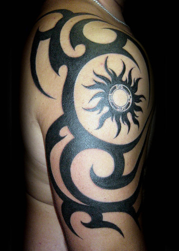 Matahari Tribal Tattoo Design Tattooed in the Strong Arm 