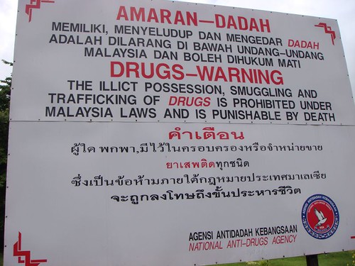 Drugs are punishable by death! Malaysia border sign post.