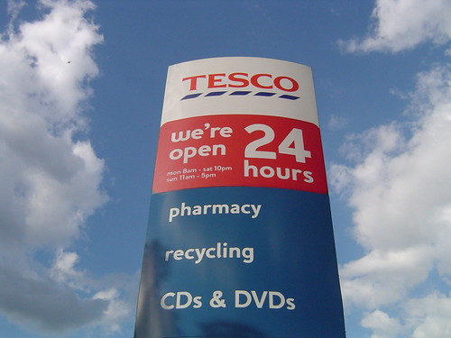 Tesco supermarket sign: We're open 24 hours