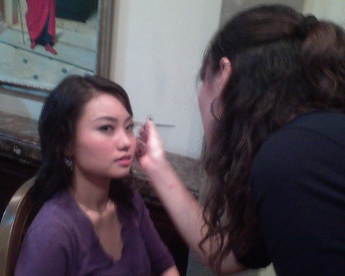Make-up artist working on Grace