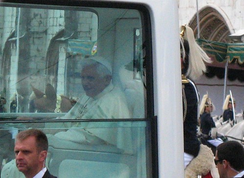In Lisbon Pope Benedict XVI waved to crowds as he proceeded through the city in his white, bullet-proof Popemobile. 