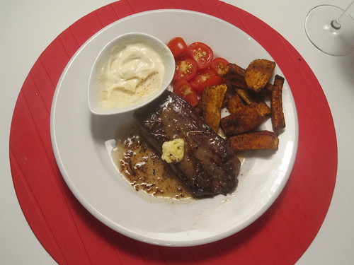 Steak with lemon butter, spiced sweet potato fries, tomato, spiced yogurt sauce