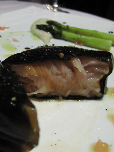 Opening up the salmon poached in asparagus