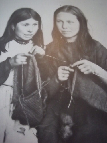 Final stages of construction in these knit-frocks, show the skills of two young Polperro girls